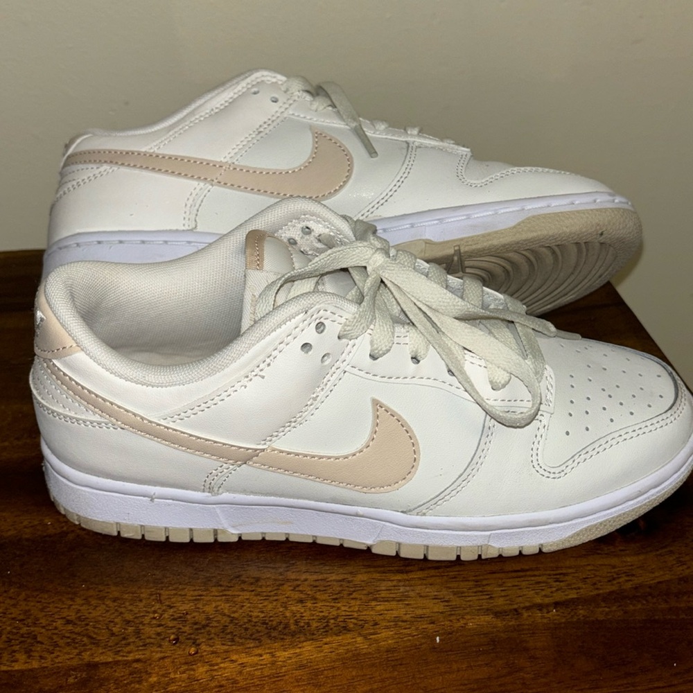 Nike dunks low. Beige swoosh and cream color.